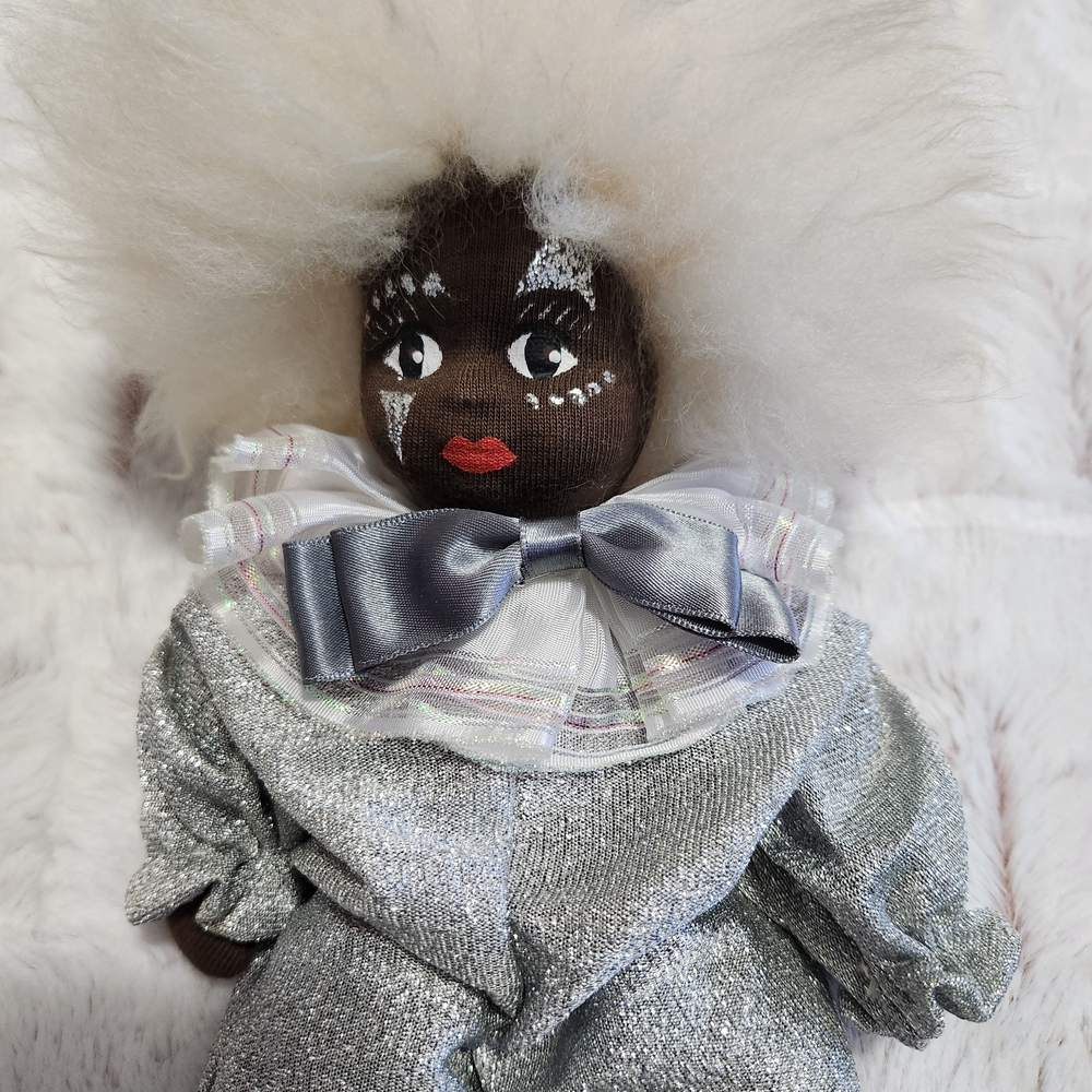 Elegant Silver and White Doll with Bow